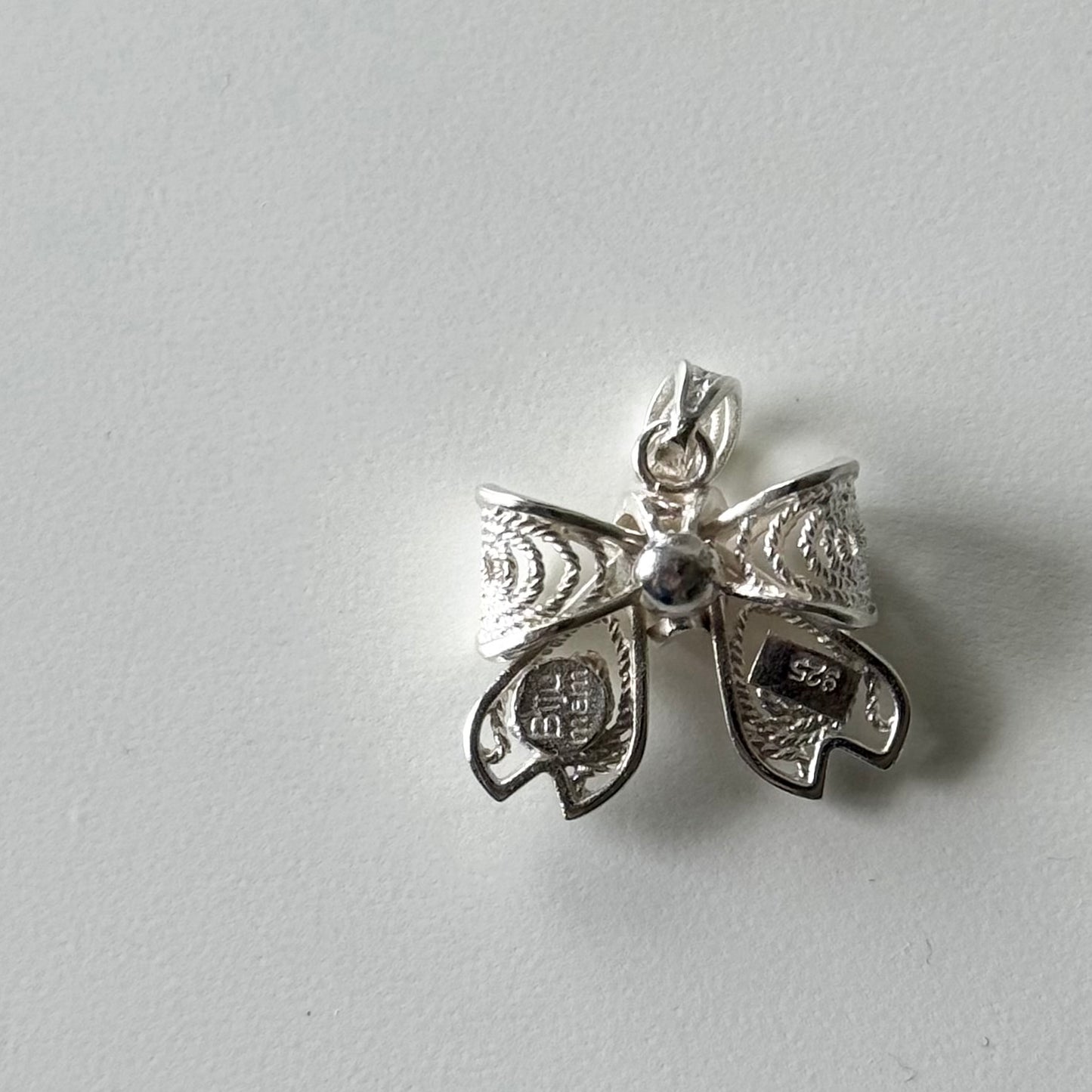 Filigree charm