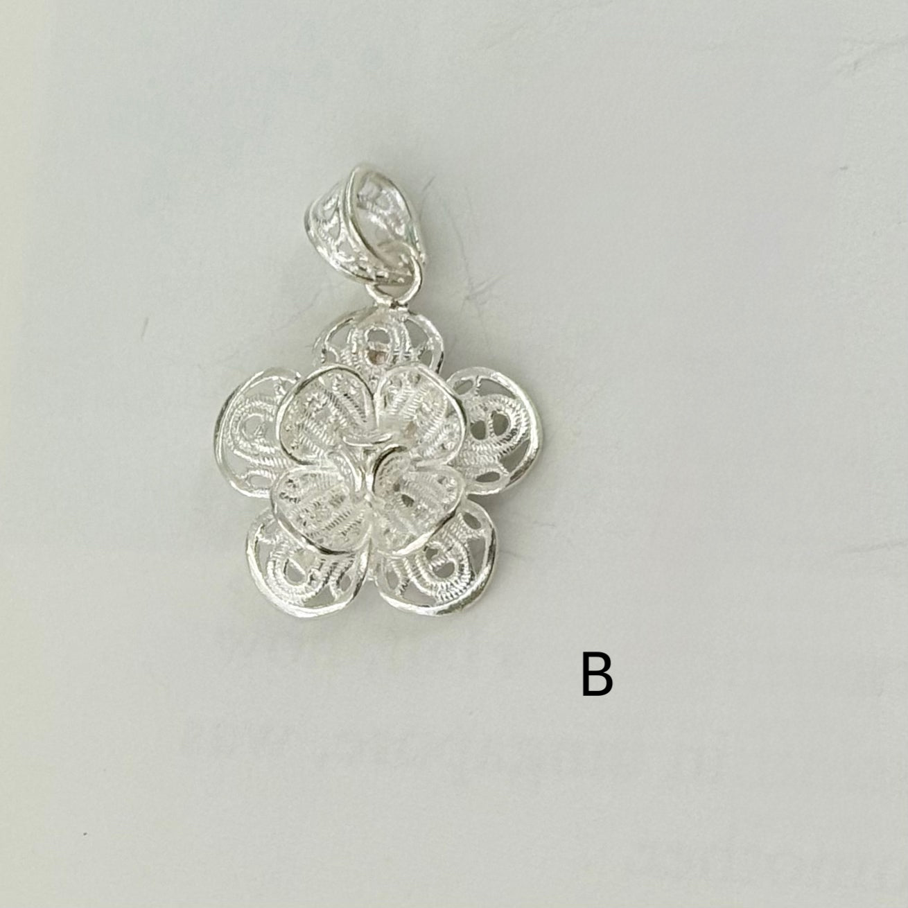 Filigree flower charm