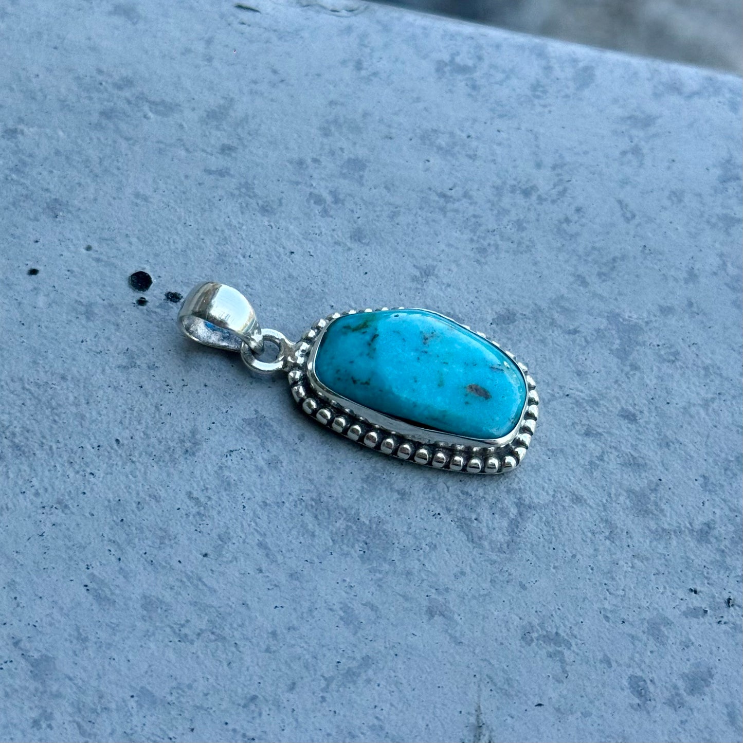 American turquoise charm