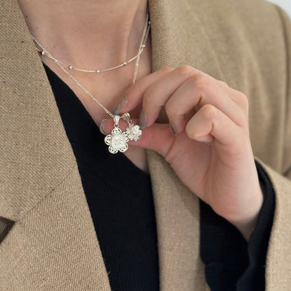 Filigree flower charm